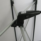Standard orientation arm light mounting clip on scissor-frame display