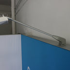 Trade show light box installation hardware in use – M8 bolt bracket locking display light in place