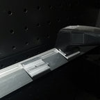 Trade show light box installation hardware in use – aluminum channel runner securing LED linear light