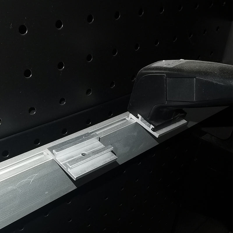 Trade show light box installation hardware in use – aluminum channel runner securing LED linear light