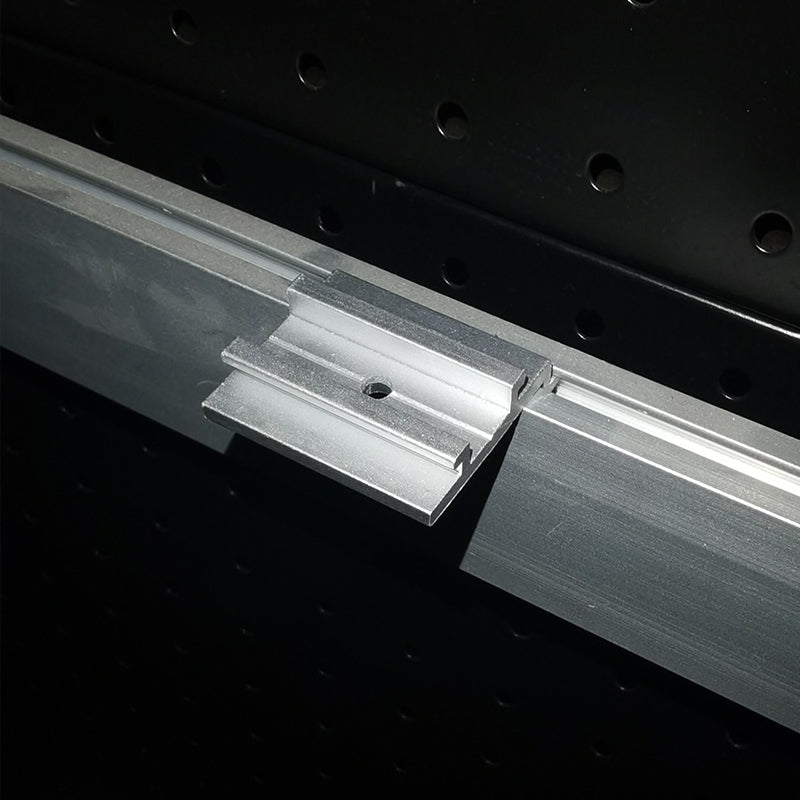 M8 aluminum sliding block installed in SEG light box channel – exhibition booth lighting setup