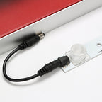 DC plug connection between linkable LED lightbox bars