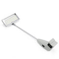 Small rectangular light with a flexible arm on a white background