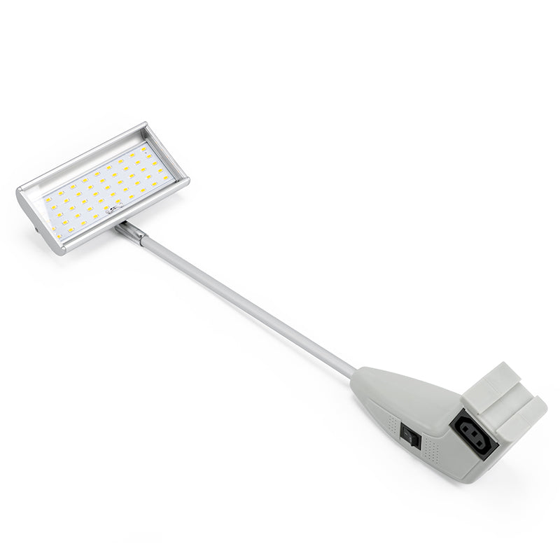 Small rectangular light with a flexible arm on a white background