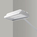 Modern kitchen hood with light on a gray background