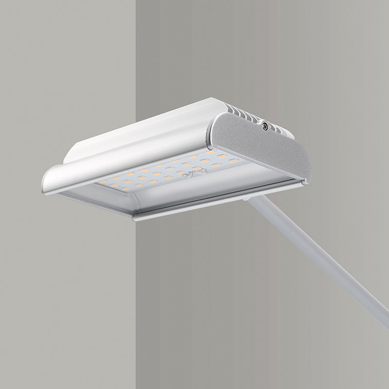 Modern kitchen hood with light on a gray background