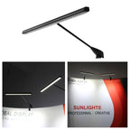 linear LED display light mounted on trade show booth clamp