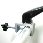 C-clamp mounting LED arm light on trade show booth wall panel – exhibitor setup